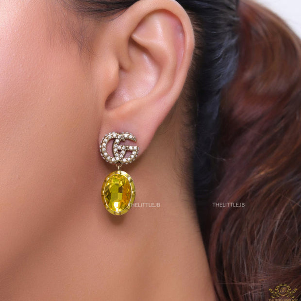 Rustic double G earings with oval yellow topaz drop
