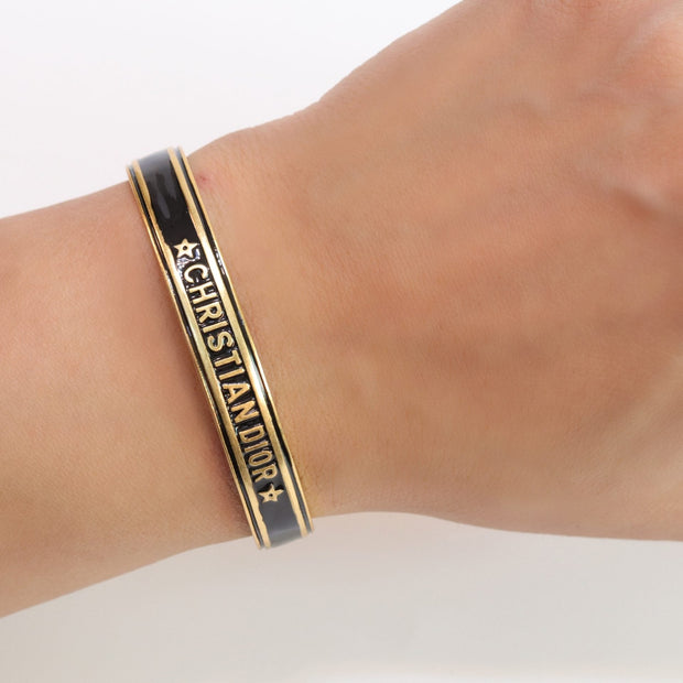 Alphabet C & D black open bracelet in gold finish
