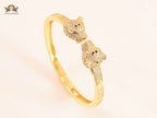 Panther heads gold and emerald bracelet