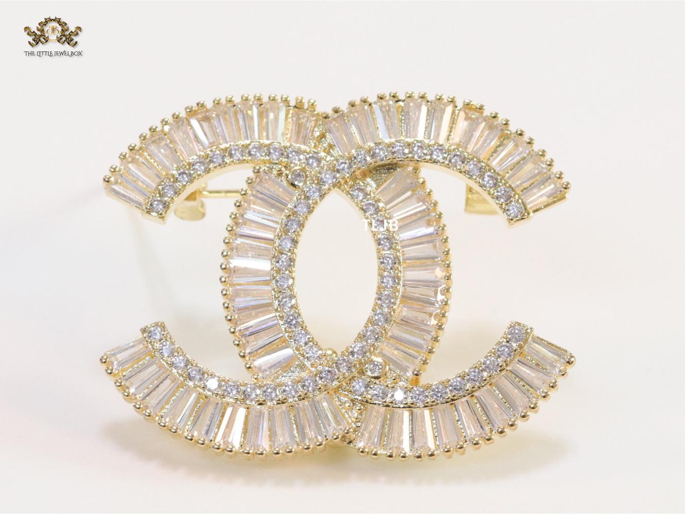 Gold finish Double C alphabet brooch with cz baguette