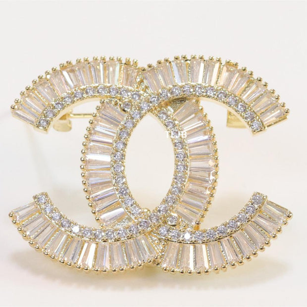 Gold finish Double C alphabet brooch with cz baguette