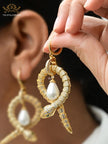 Platinum snake & pearl statement earrings
