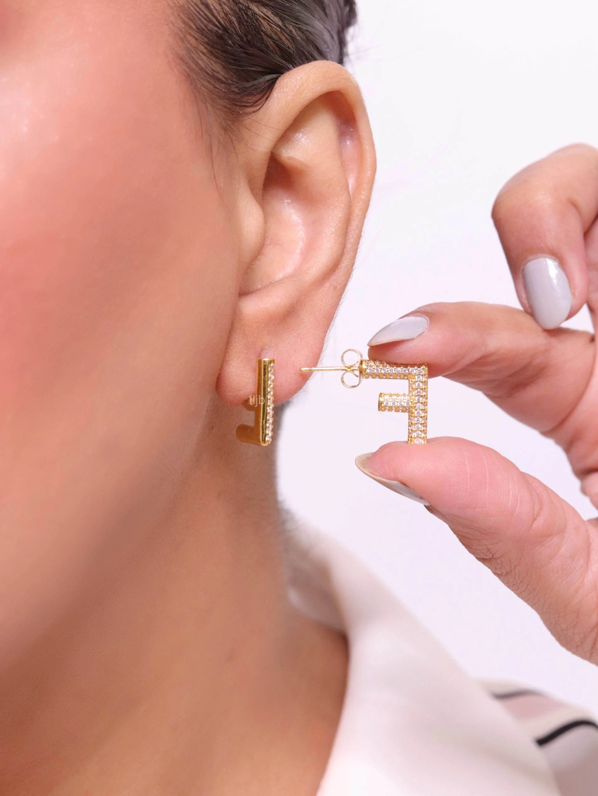 Alphabet F cz earrings in gold finish