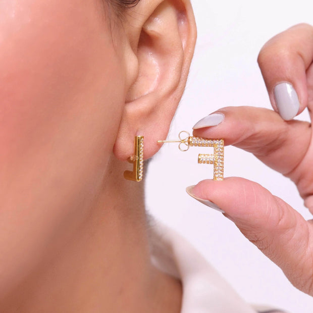 Alphabet F cz earrings in gold finish