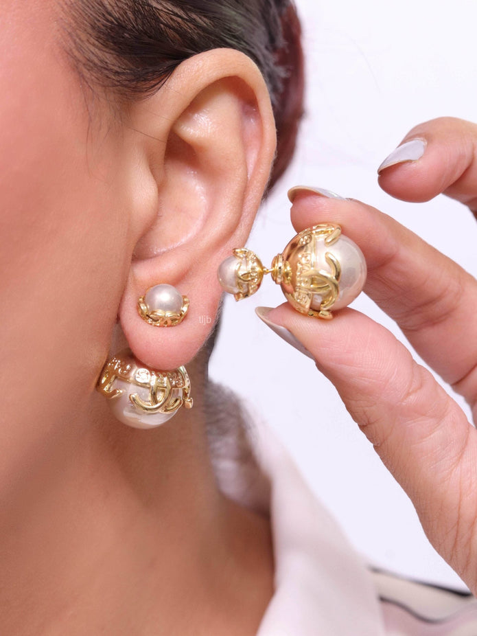 Double C beige pearl studs in gold finish