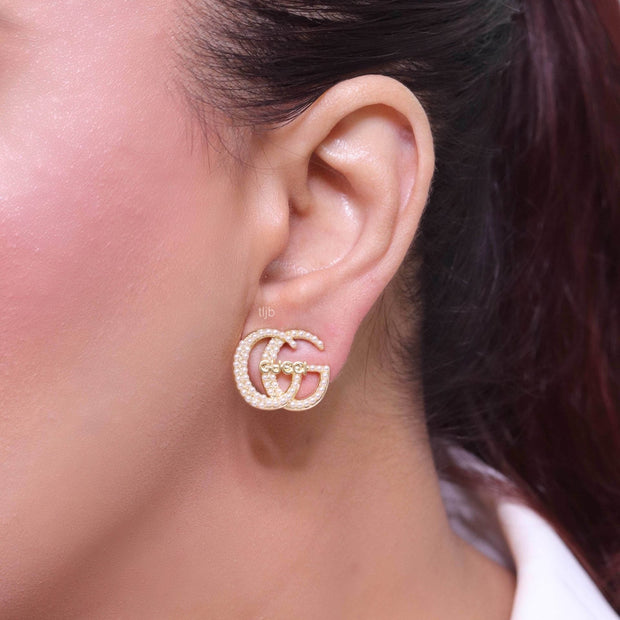 Double G pearl earrings in gold finish