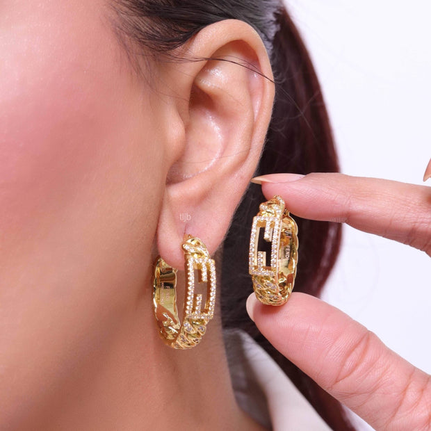 Double F hoops in gold finish with cz