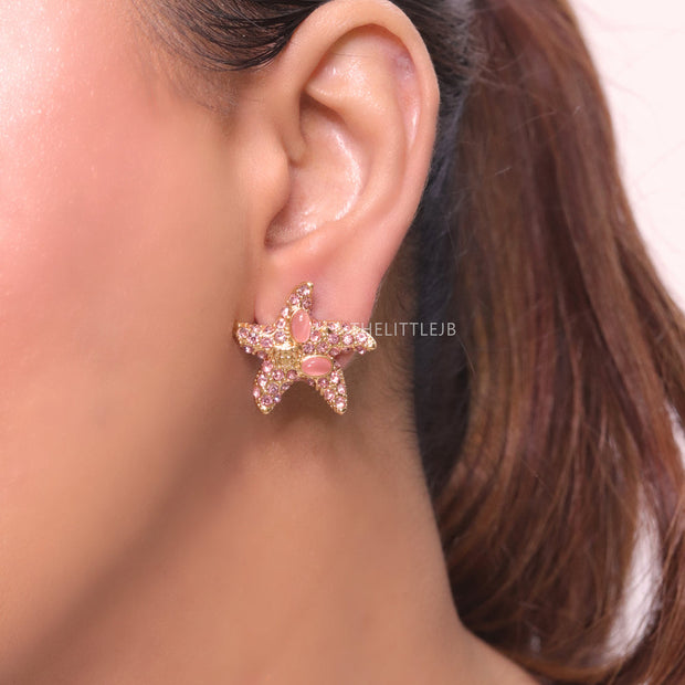 Pink gold star studs