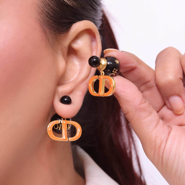 Black and Orange alphabet C and D stud in gold finish