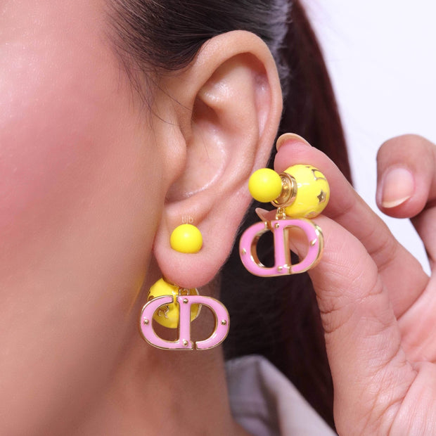 Pink and Yellow alphabet CD stud in gold finish