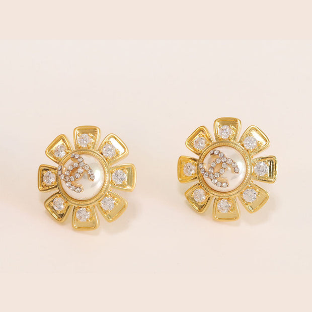 Gold sun double C CZ and Pearl earrings