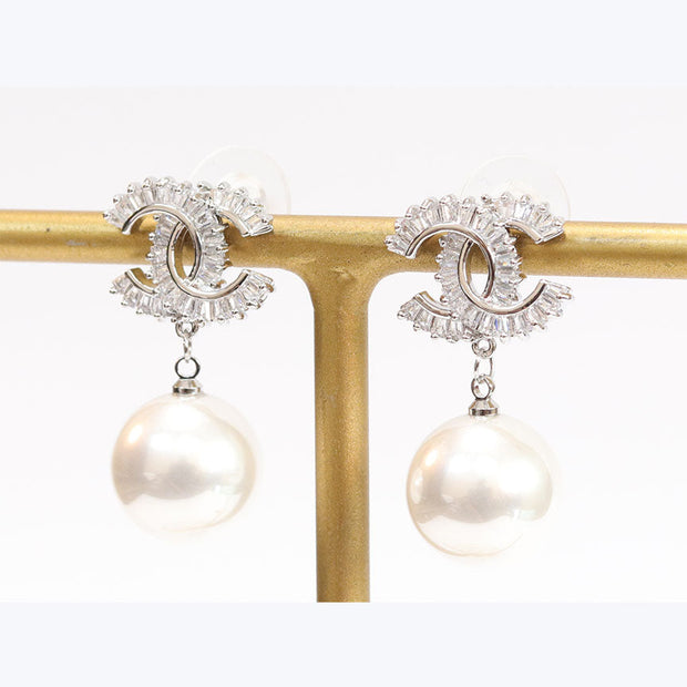 Double C cz baguette and pearl silver earrings
