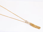 Gold panther face sleek tassel pendant
