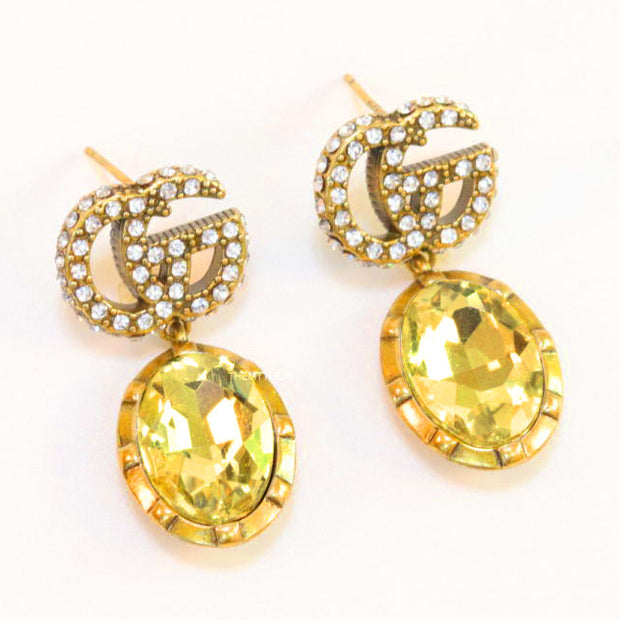 Rustic double G earings with oval yellow topaz drop