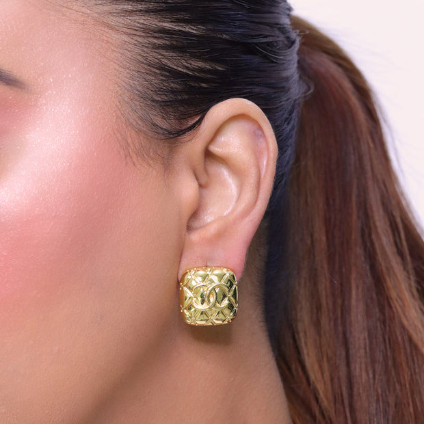 Embossed gold studs