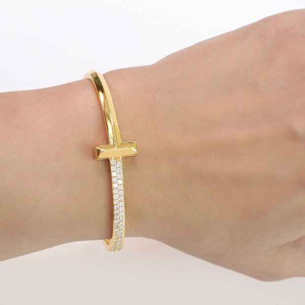 Alphabet T bracelet with half CZ in gold finish