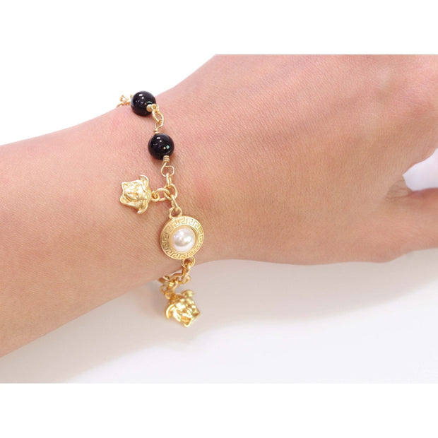 Gold medusa charms bracelet