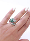 Platinum snake ring with green CZ