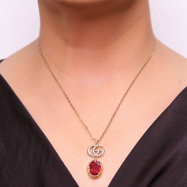 Alphabet G ruby drop pendant