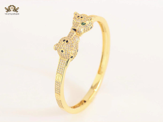 Panther heads gold and emerald bracelet
