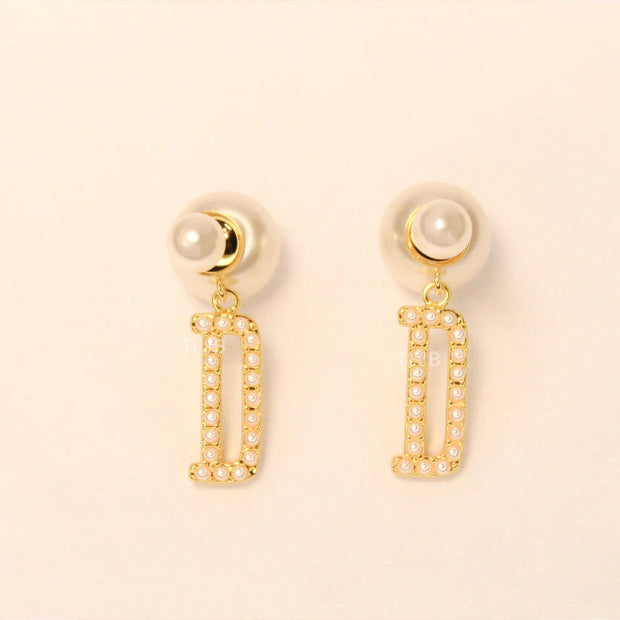alphabet D pearl studded bomber earrings