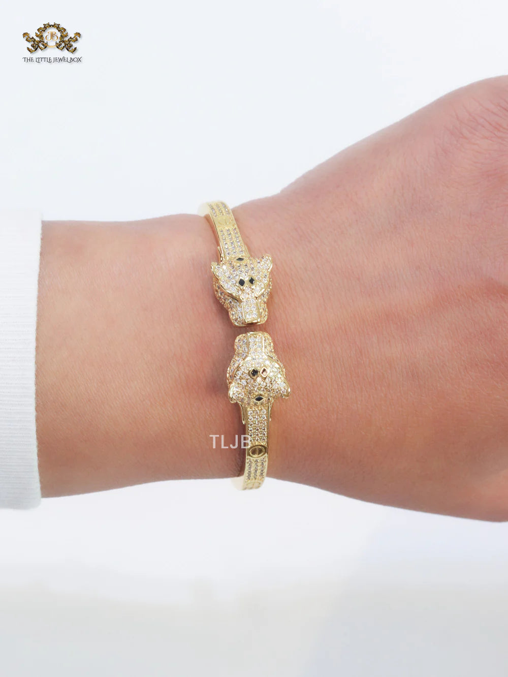 Panther heads gold and emerald bracelet