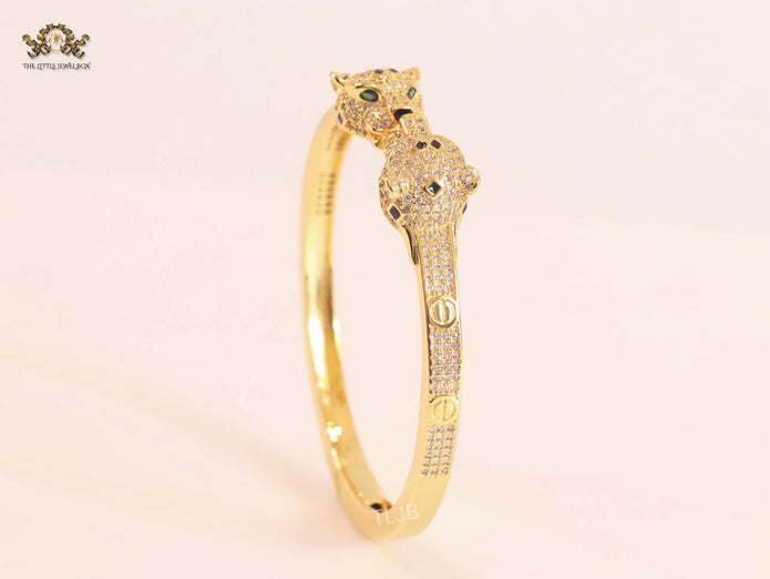 Panther heads gold and emerald bracelet