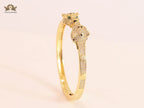 Panther heads gold and emerald bracelet