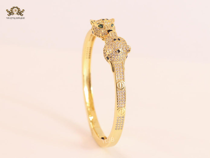 Panther heads gold and emerald bracelet