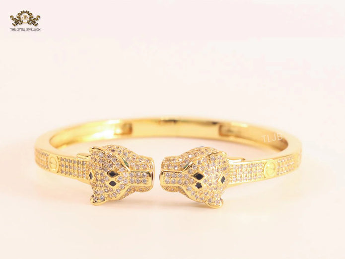 Panther heads gold and emerald bracelet