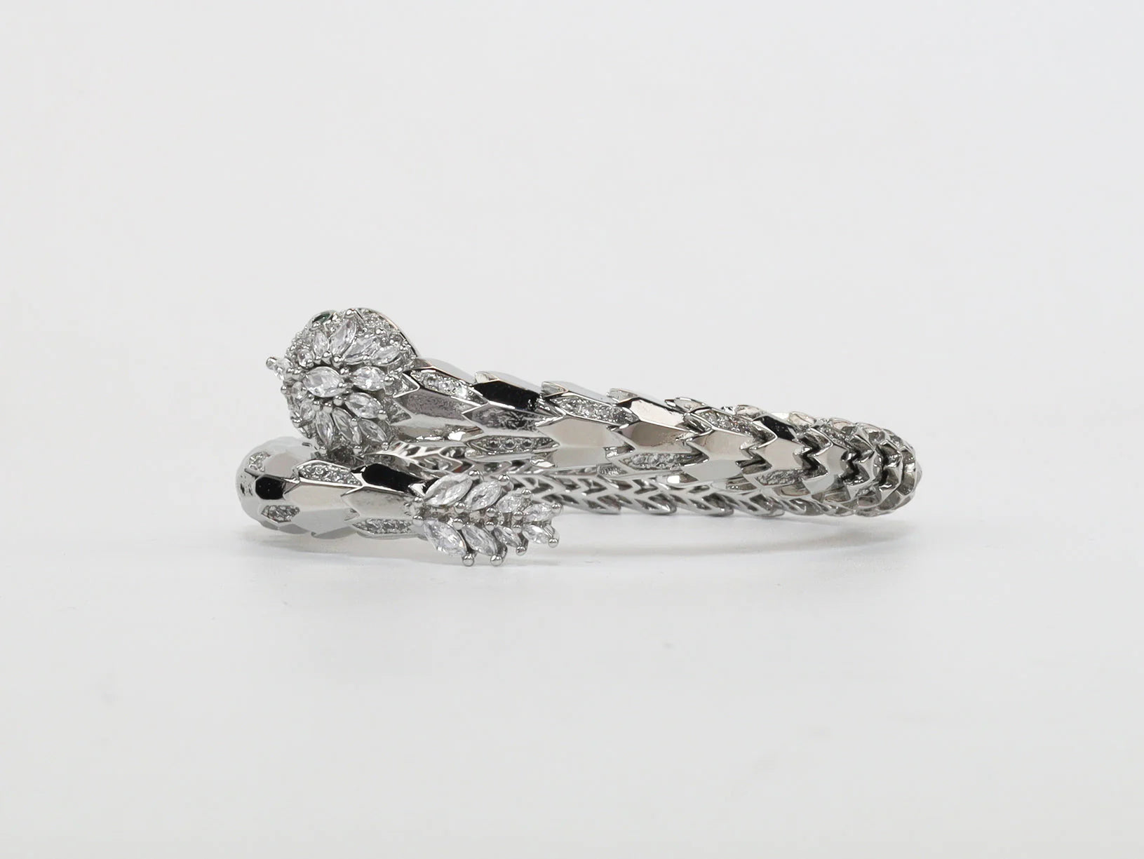 Platinum Snake head cz bracelet with emerald detailing