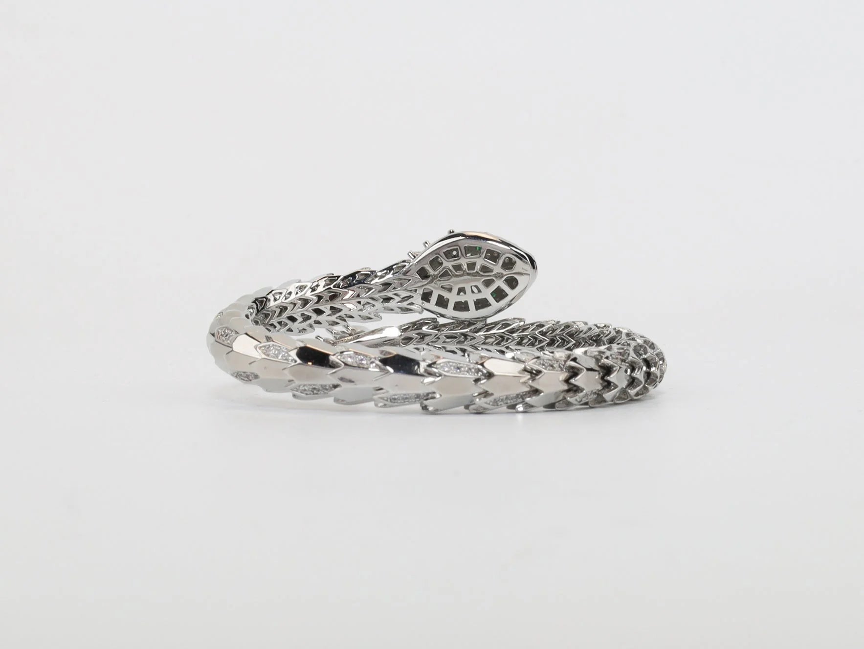 Platinum Snake head cz bracelet with emerald detailing