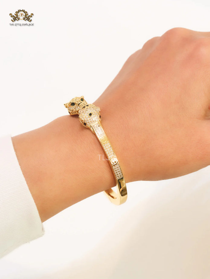 Panther heads gold and emerald bracelet