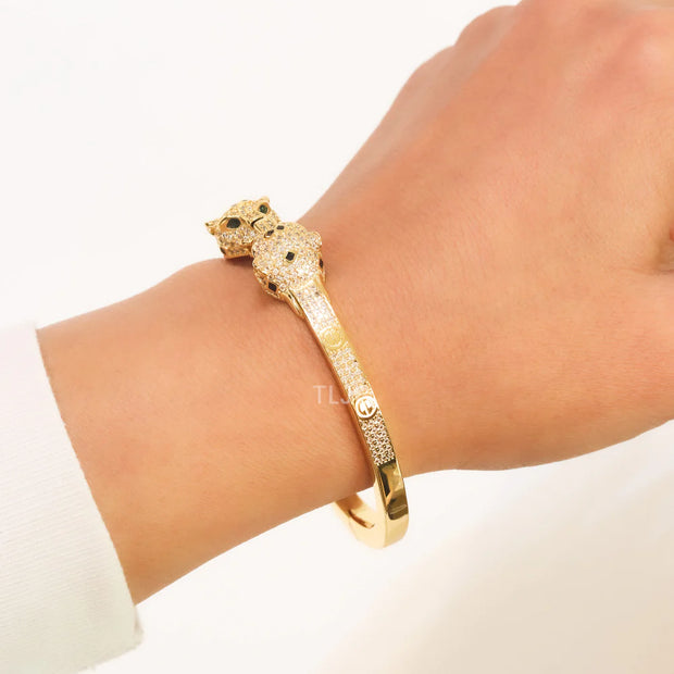 Panther heads gold and emerald bracelet