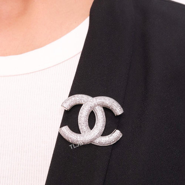 Platinum plated double C alphabet brooch with tiny cubic zirconia stones