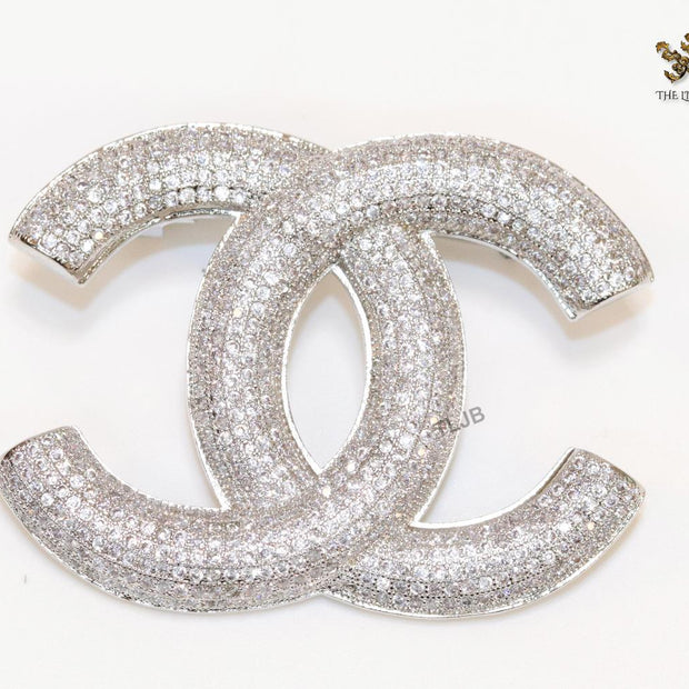 Platinum plated double C alphabet brooch with tiny cubic zirconia stones