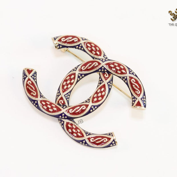 Double C red and blue embossed gold Brooch