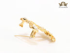Twin C brooch in matte gold and fancy cz