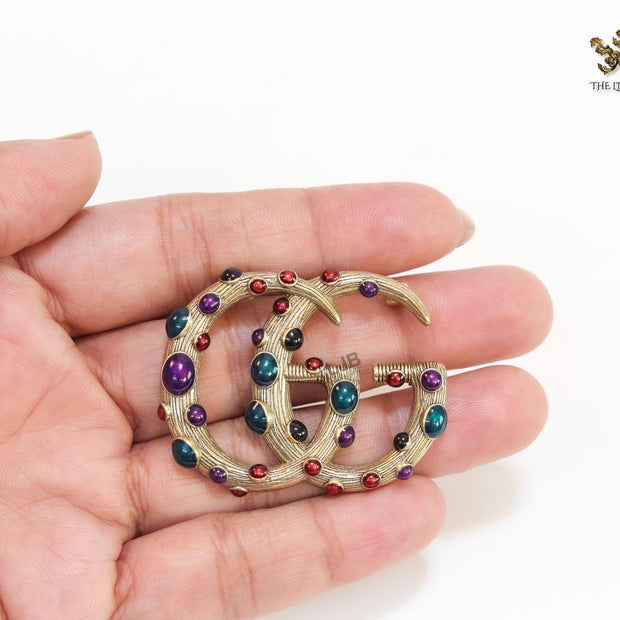 Rustic twin G brooch with multi coloured stones