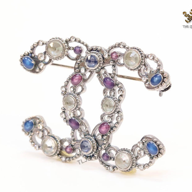 Antique platinum finish double C brooch with multi coloured stones