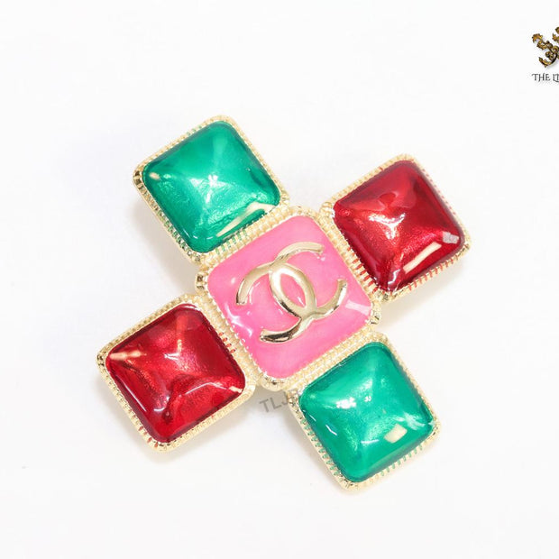 Multi Coloured enamel coated golden brooch with twin C motif