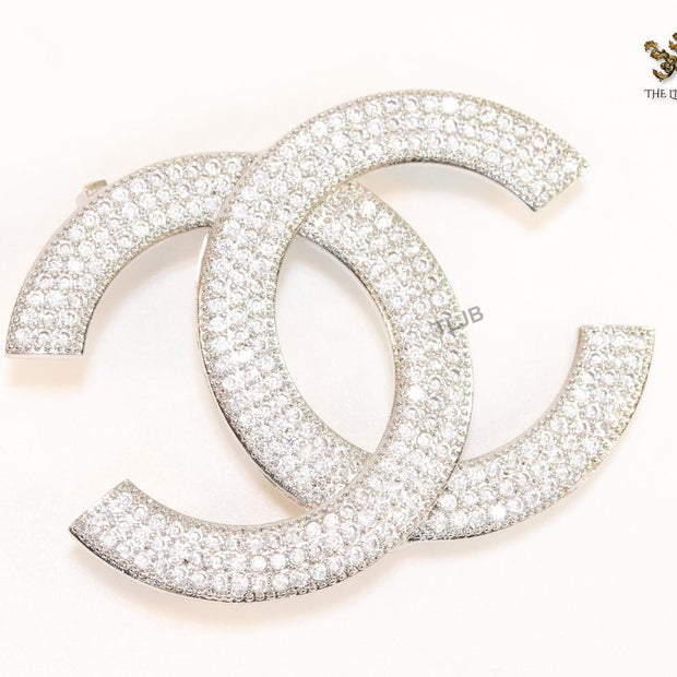 Platinum plated twin C brooch with cz