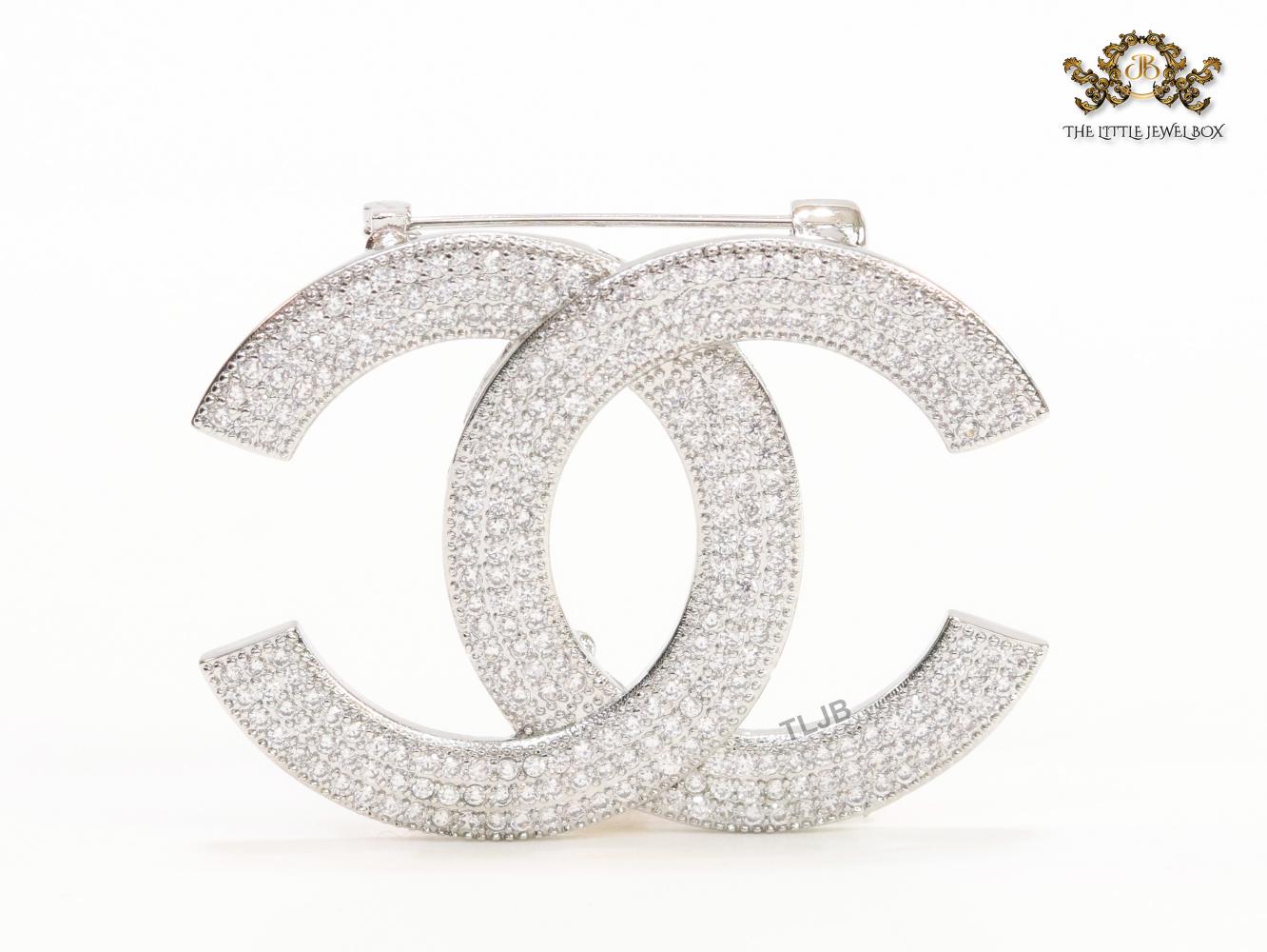 Platinum plated twin C brooch with cz