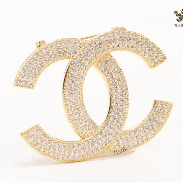 Gold plated twin C brooch with cz
