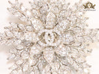 Flower and leaf brooch in platinum finish and cz