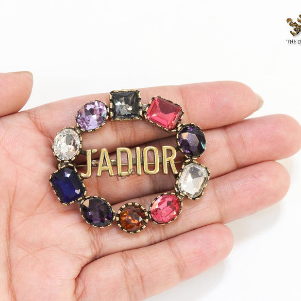 Multi stone brooch with alphabets