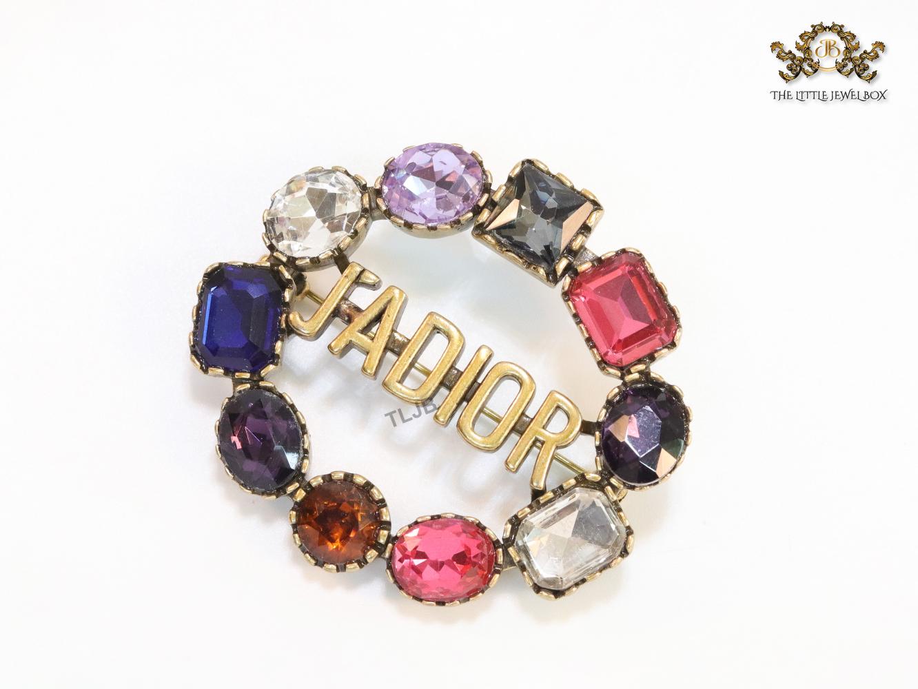 Multi stone brooch with alphabets