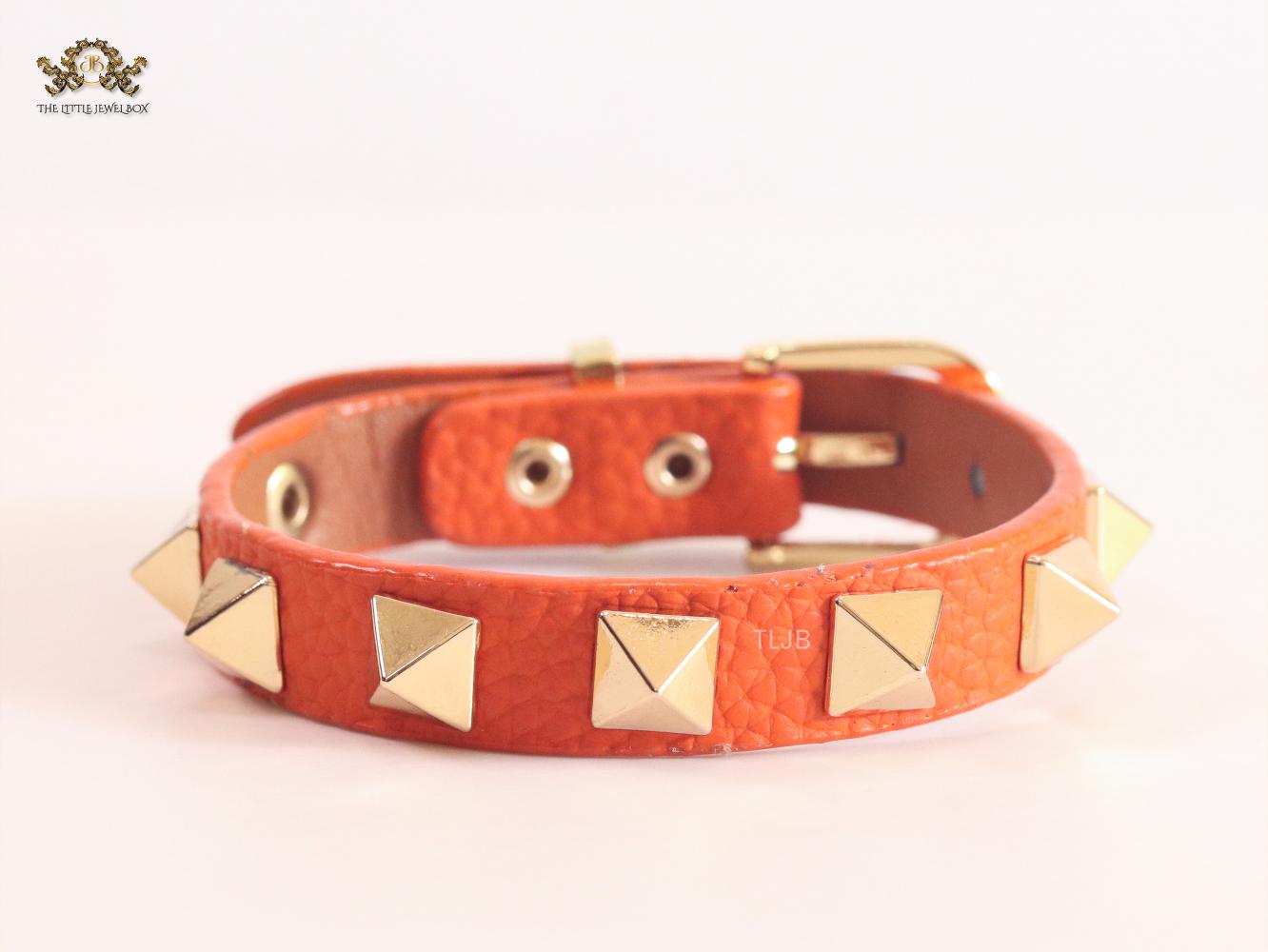 Alphabet V rockstud orange bracelet