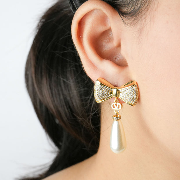 Alphabet V Bow Motif Long Pearl Dangler with CZ in Gold | Elegant Drop Earrings