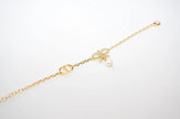 Gold Bow CZ Bracelet with Pearl Charm